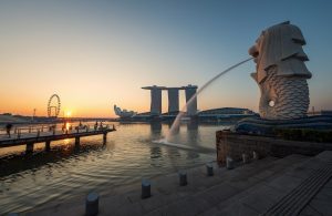 singapore merlion spitting water at one fullerton overlooking Marina Bay Sands hotel, art science museum