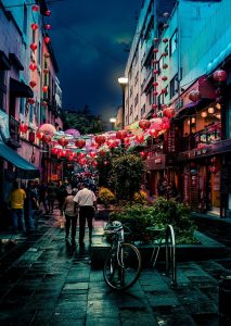 chinatown at night, bicycles, street with people, Chinese red lanterns