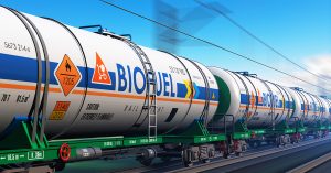 Fuel, oil and gas industry, ecology protection technology, logistics, cargo shipping and freight railroad transportation business concept: fast train with tankcars with biofuel with motion blur effect