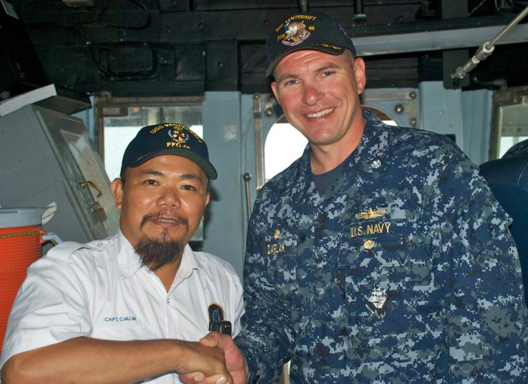 Captain Martin with commanding officer Captain Joseph Darlak onboard USS Vandergriff