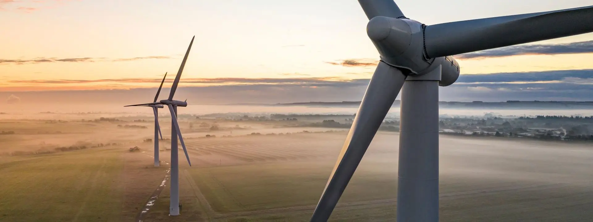 Three wind farm structures at sea