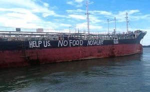 Abandoned crew scrawl their desperate plight along ship’s hull