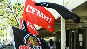 Construction, Forestry, Maritime, Mining and Energy Union (CFMEU) signs.