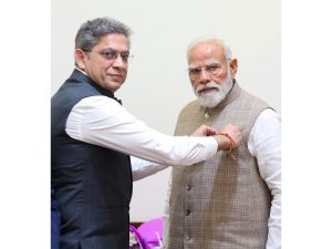 PM Narendra Modi receives Merchant Navy miniature flag (Photo/MOPSW)